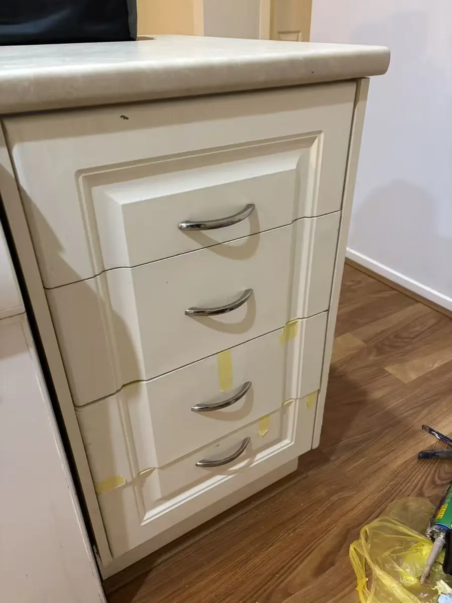 White kitchen drawer fronts refitted and aligned after repair