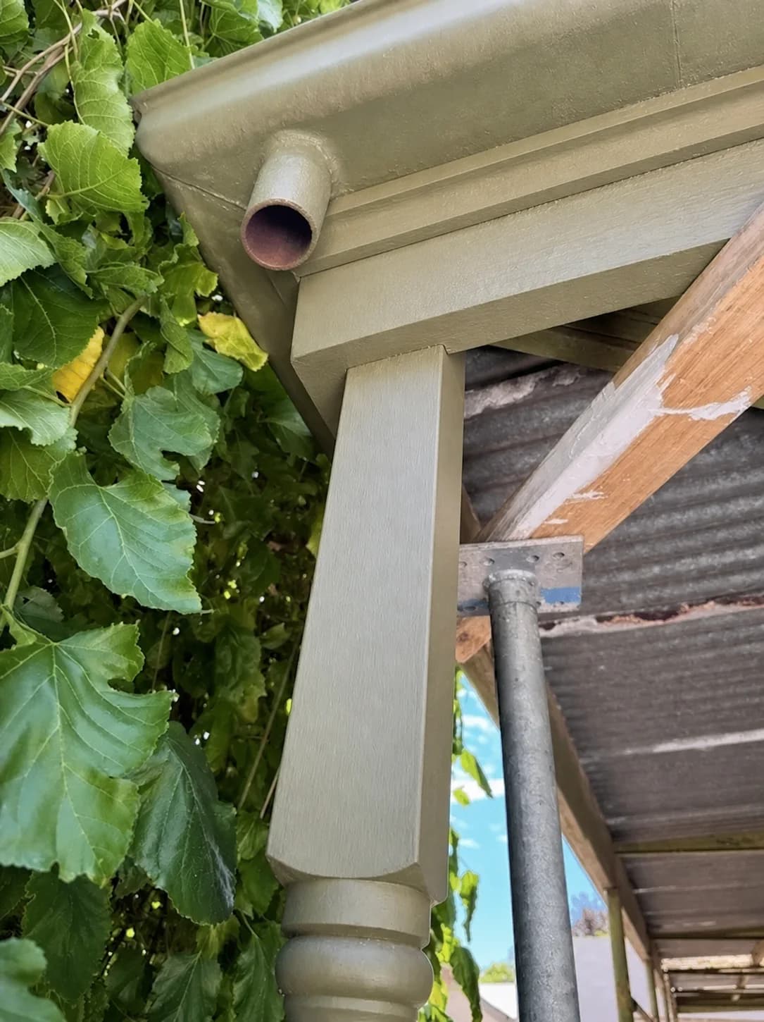 Repaired outdoor roof corner with the deteriorated timber renewed and recoated